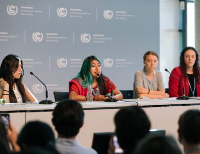 Xananine on stage with Greta Thunberg in Bonn Climate Change Conference